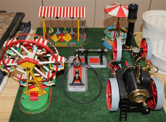 A Wilesco tinplate livesteam model fairground with traction engine
